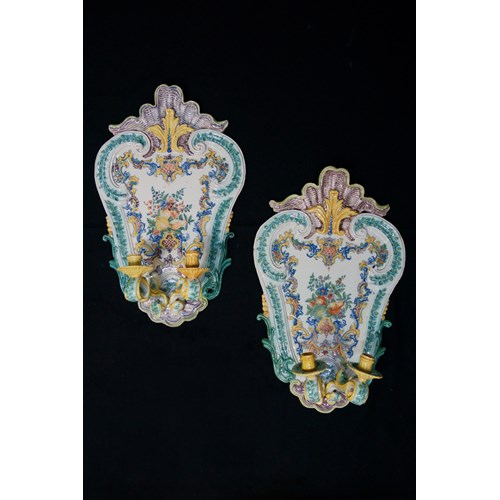 A very important and unique pair of late-Baroque Italian polychrome majolica two- light wall-sconces